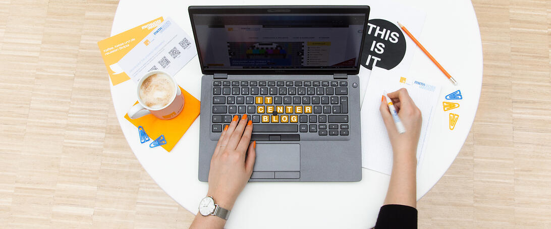Hands with laptop and coffee